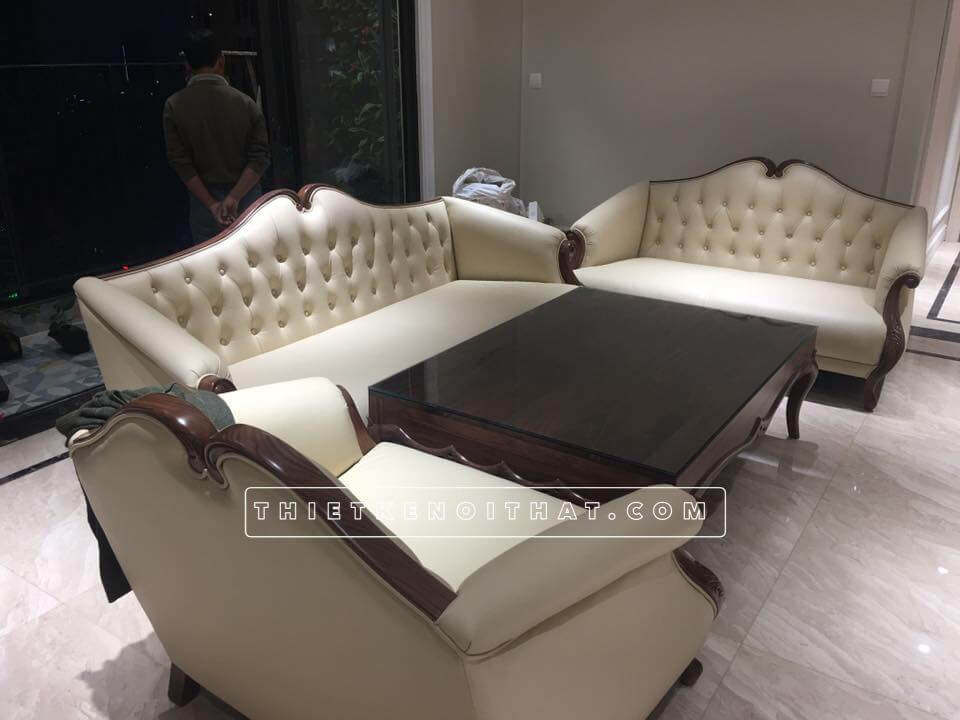 Sofa tân cổ điển có kiểu dáng tân cổ điển Pháp với đặc trưng nút chần cách điệu, tay vai sofa thoải Mẫu sofa gỗ tự nhiên, gỗ óc chó đẹp